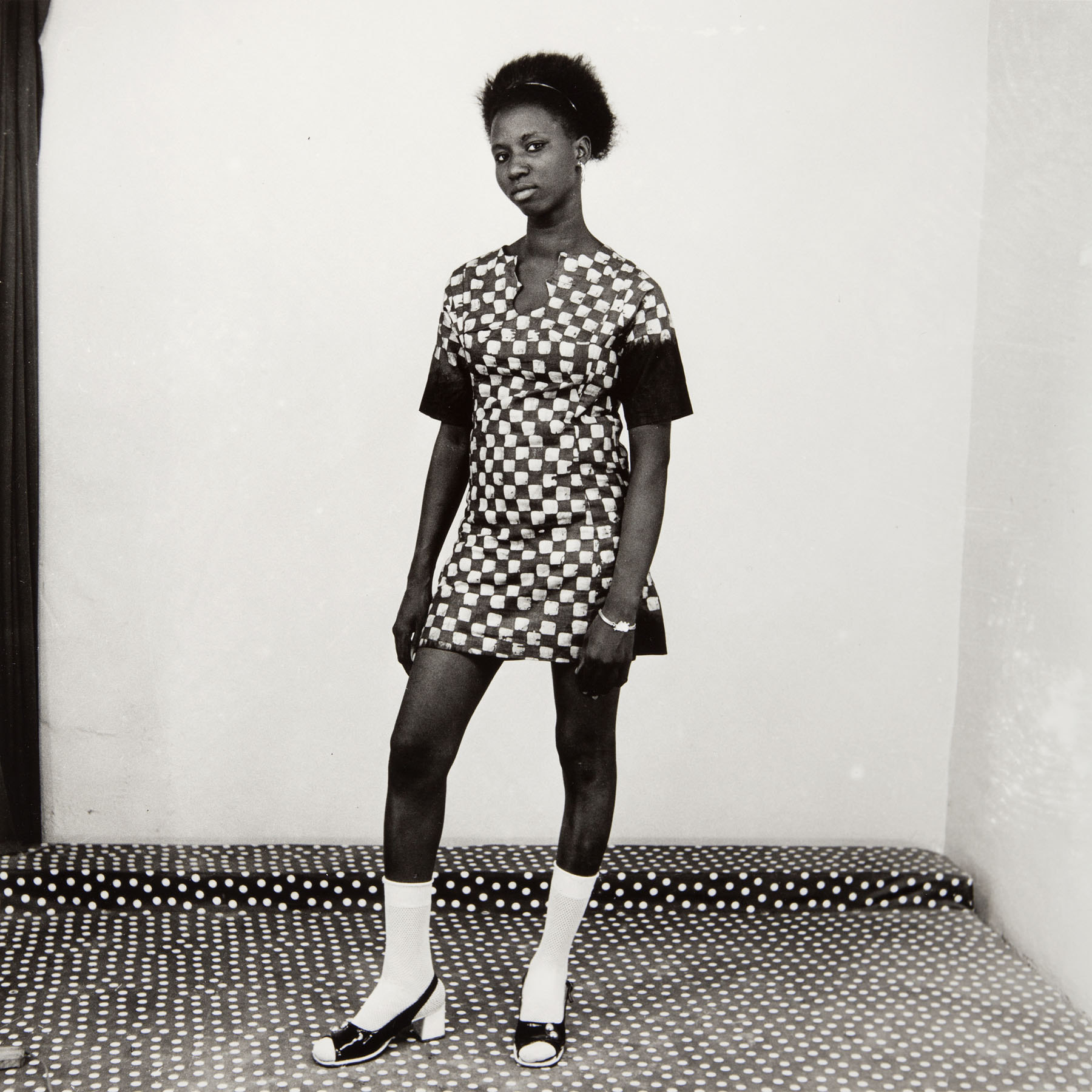 Malick Sidibé, Woman in a Checkered Dress, 1971. Gelatin silver print. © Malick Sidibé / Gwinzegal / diChroma photography